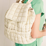 Black Solid Flapped Quilted Puffer Backpack